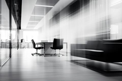 A bright meeting room seen from the doorway